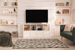 © New Africa - Modern TV on cabinet, comfortable sofa and decor elements in living room