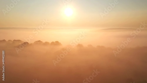 Fototapete - Breathtaking panoramic view of the foggy terrain in the morning light. Filmed in UHD 4k video.