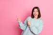 Photo of youth cheerful lady indicate fingers empty space proposition suggest direct isolated over pink color background