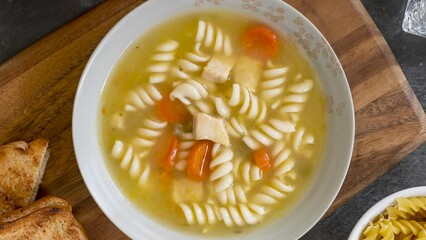 Wall Mural - Rotating Bowl of Chicken Noodle Soup