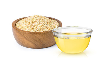 Wall Mural - Quinoa oil in glass bowl and quinoa seeds in wooden bowl isolated on white background.