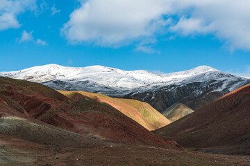 Wall Mural - Panoramic view of red striped mountains in winter