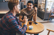 © BullRun - Multiracial business men working in office space