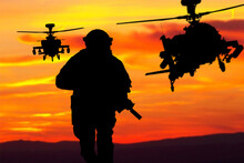 Silhouette Of Infantry Soldier, Marine Corps Fighter, Navy Special Operations Team Member In Full Tactical Ammunition Running With Weapon In Hands During Airborne Operation With Helicopters Support
