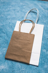 Wall Mural - paper shopping bags in different sizes and colours, concept of branding and competition