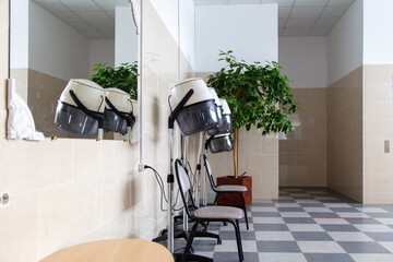 Wall Mural - Devices for drying hair in a beauty salon.