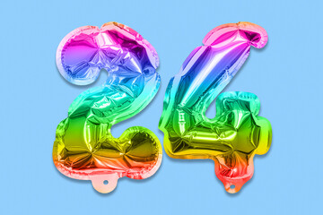 Wall Mural - Rainbow foil balloon number, digit twenty four on a blue background. Birthday greeting card with inscription 24. Top view. Numerical digit. Celebration event, template.