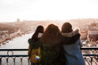 © Eva - Three happy friends Porto bridge sightseeing at sunset. Travel, friendship and Lifestyle