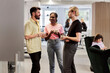 © Johnér - Smiling people talking in cafeteria during coffee break