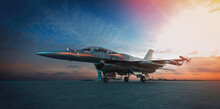 Military Jet Aircraft Parked On Runway In Sunset.