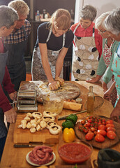 Wall Mural - Food is essential to life, therefore, make it good. Shot of a group of seniors attending a cooking class.