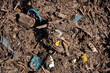 Plastic soup, detail of compost used in agriculture, polluted with plastic