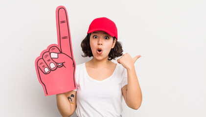 Wall Mural - pretty hispanic girl looking astonished in disbelief. number one hand fan concept