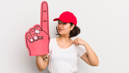 Wall Mural - pretty hispanic girl looking arrogant, successful, positive and proud. number one hand fan concept