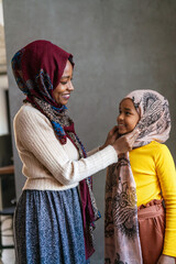 Wall Mural - Portrait of traditional muslim mother with her girl child. People, family, religion concept