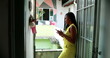© Marco - Candid black African woman checking cellphone at home