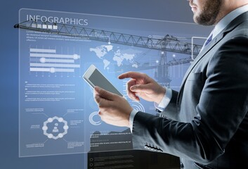 Wall Mural - Businessman hands using tablet with networking security information technology global  with innovation icon virtual screen, Digital and construction cranes on city background.