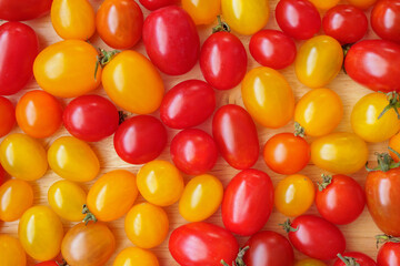 Wall Mural - Variety of colorful organic tomato background