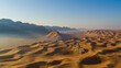 © AmazingAerialAgency - Aerial view of sand dunes near the Sphinx in the desert at sunset, Dubai, United Arab Emirates.