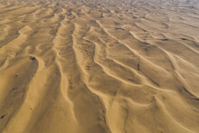 Aerial View Of Sand Dunes In The Desert At Sunset, Dubai, United Arab Emirates.