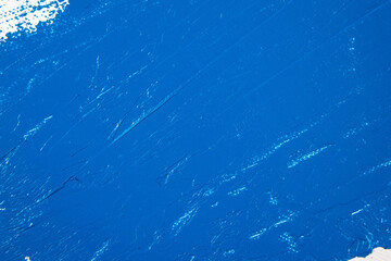 Wall Mural - deep blue abstract background, applied toning primer on a white surface