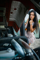 Wall Mural - Girl with long black hair in the countryside. Ipadrome with horses. Rural landscapes, wild west.