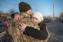 Elderly Mother Says Goodbye To Her Military Son. Mom Hugs A Ukrainian Soldier. Militarization. Ukrainian Defender Says Goodbye To His Family. Mobilization Of Ukrainian Men. War Of Ukraine And Russia