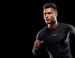 © D M/peopleimages.com - Always give 100 percent. Studio shot of a handsome young man running against a black background.