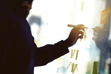 Aufkleber - Planning is key. Cropped shot of a businessman writing notes on a glass wall in an office.