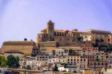 Wall Mural - A sea side view to the Ibiza Old Town with Cathedral of Santa Maria d`Eivissa at the top of the hill in Ibiza, Spain.