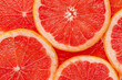 Red grapefruit background. Top view, close up.