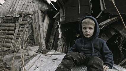 child playing war in ruins