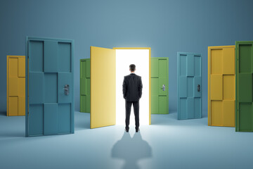 Man standing in front of abstract colorful puzzle door in interior. Future, choice, success, direction, opportunity and solution concept.