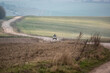 © Martin - a quad biker with lights on riding his off-road quad bike along a stone track open countryside