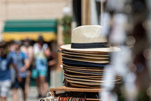 Stack Of Men And Women Summer Hats On The Street Market, Selective Focus, Closeup