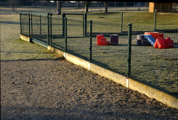 fence with a lower part which is made of concrete slabs as protection against game. undercutting the fence may occur. now the house and garden are protected.