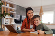 © bnenin - Mother's day, lovely portrait of mother and son, smiling for the photo, while studying.