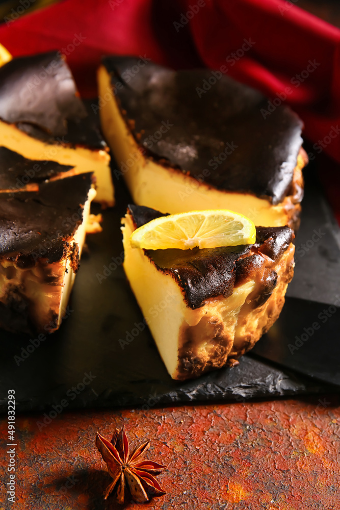 Tasty Basque burnt cheesecake on color background