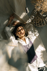 Portrait of a beautiful girl with Cuban roots in stylish clothes and sunshine