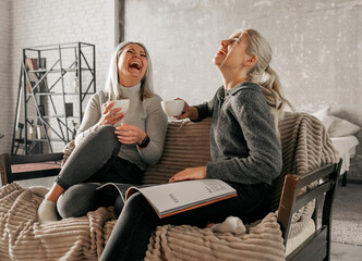 Wall Mural - Mother With Teenage Daughter At Home Talking and laughting