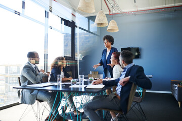 Aufkleber - Discussing their latest and biggest plan. Shot of a group of businesspeople having a meeting in the boardroom.