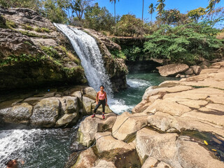 Wall Mural - Tourist enjoying the beautiful hot spring waterfall of El Salto de Malacatiupan, Atiquizaya, El Salvador