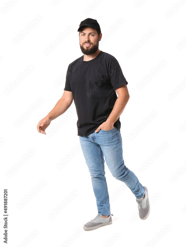Handsome man with cap in black t-shirt on white background
