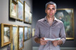 © JackF - Adult male is visiting at the pictures exposition with brochure in the museum.