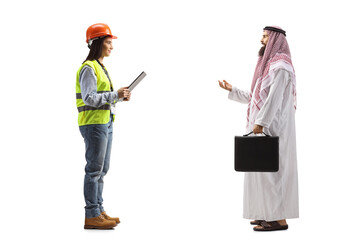 Sticker - Full length profile shot of an arab businessman talking to a female engineer