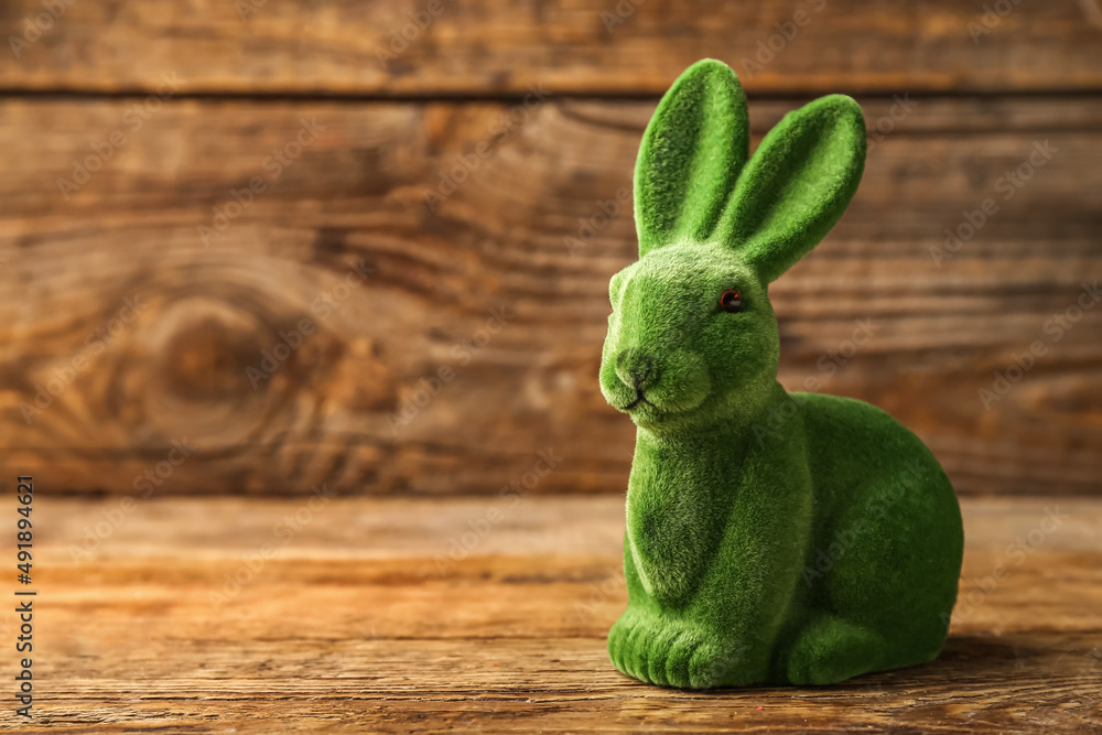 Cute Easter bunny on wooden background
