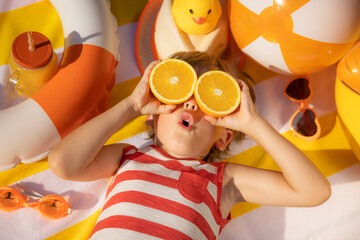 Poster - Happy child lying on beach towel