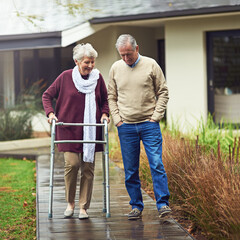 Wall Mural - Youre only as old as you feel. Shot of a loving senior couple taking a walk outside.