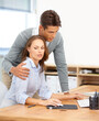 © Alexandra/peopleimages.com - Its not a compliment, its harassment. Shot of a man touching his female colleague inappropriately.