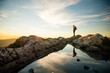 © Cavan Images - confident backpacker standing on summit ridge, Vancouver B.C.